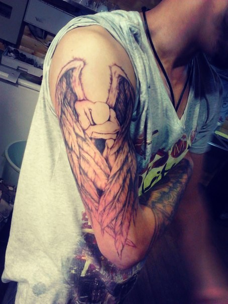 Фотография татуировки под названием «ангел»