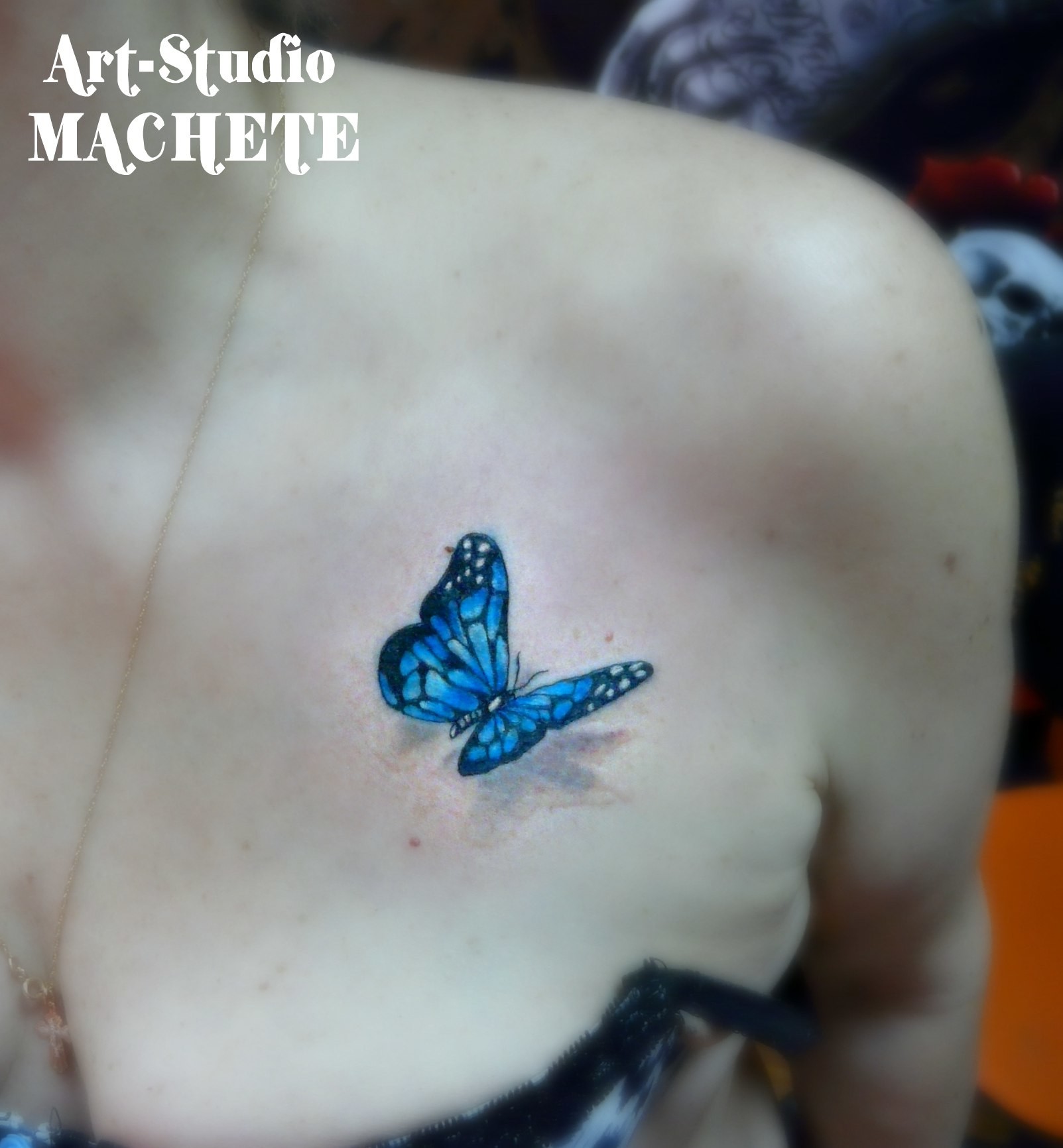 Фотография татуировки под названием «Бабочка синяя»