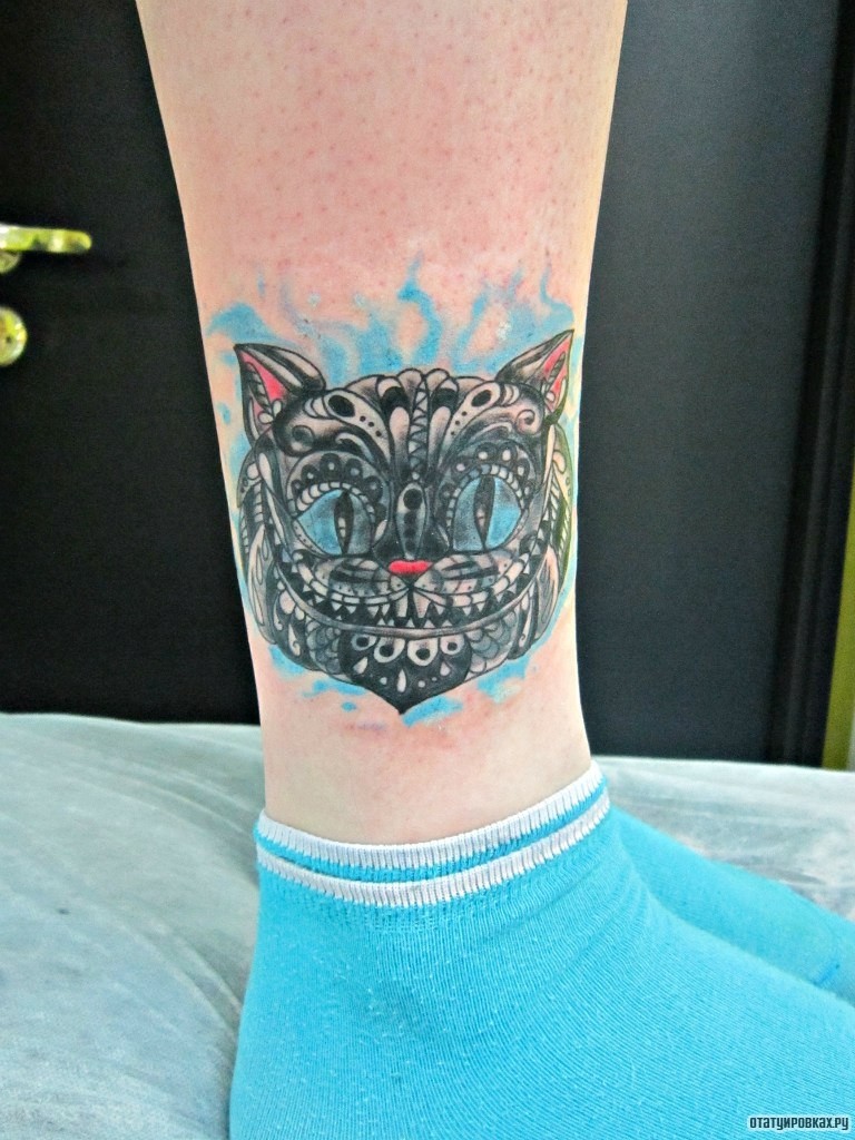 Фотография татуировки под названием «Кот чеширский»