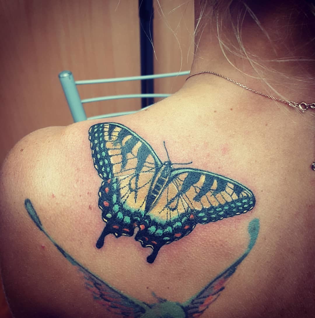 Фотография татуировки под названием «Бабочка»