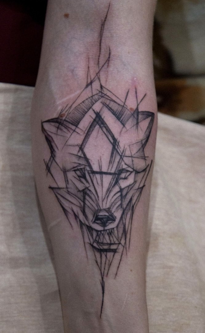 Фотография татуировки под названием «Волк»