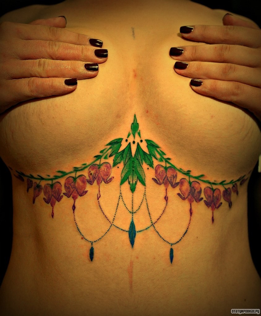 Фотография татуировки под названием «Узоры с цветами»