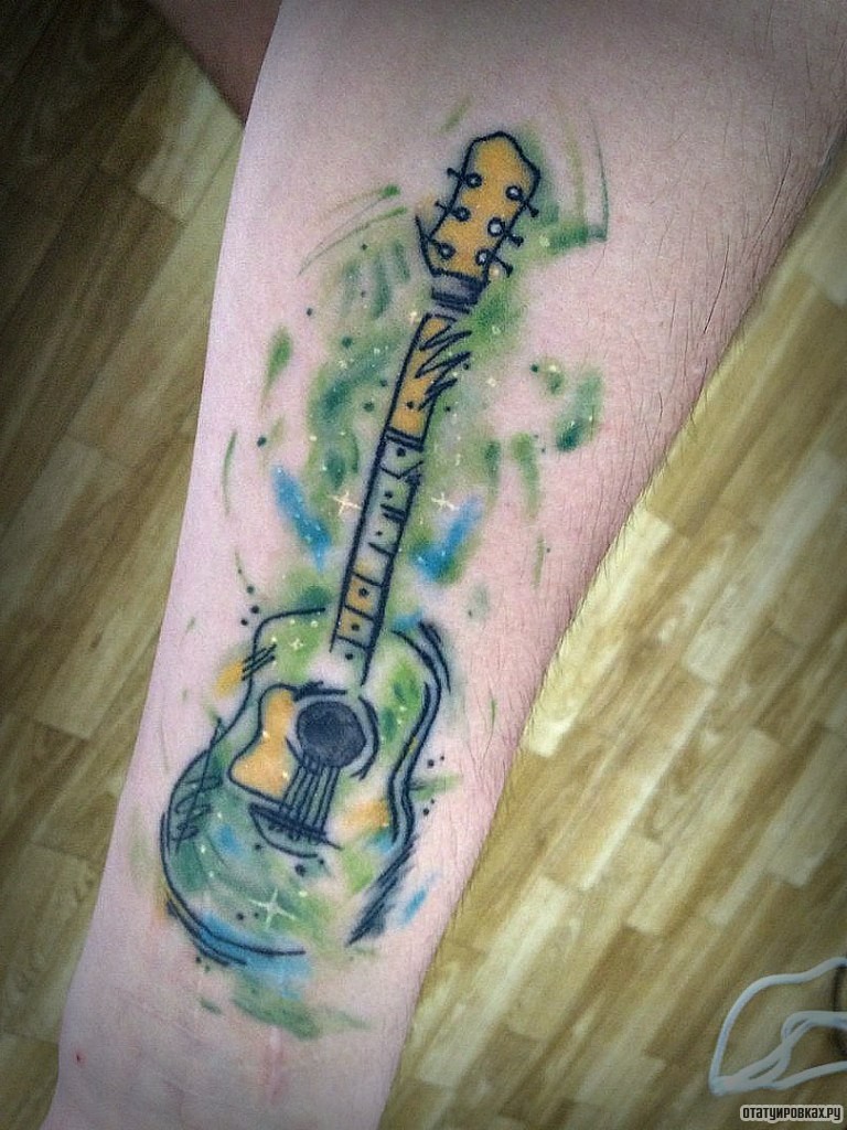 Фотография татуировки под названием «Гитара»