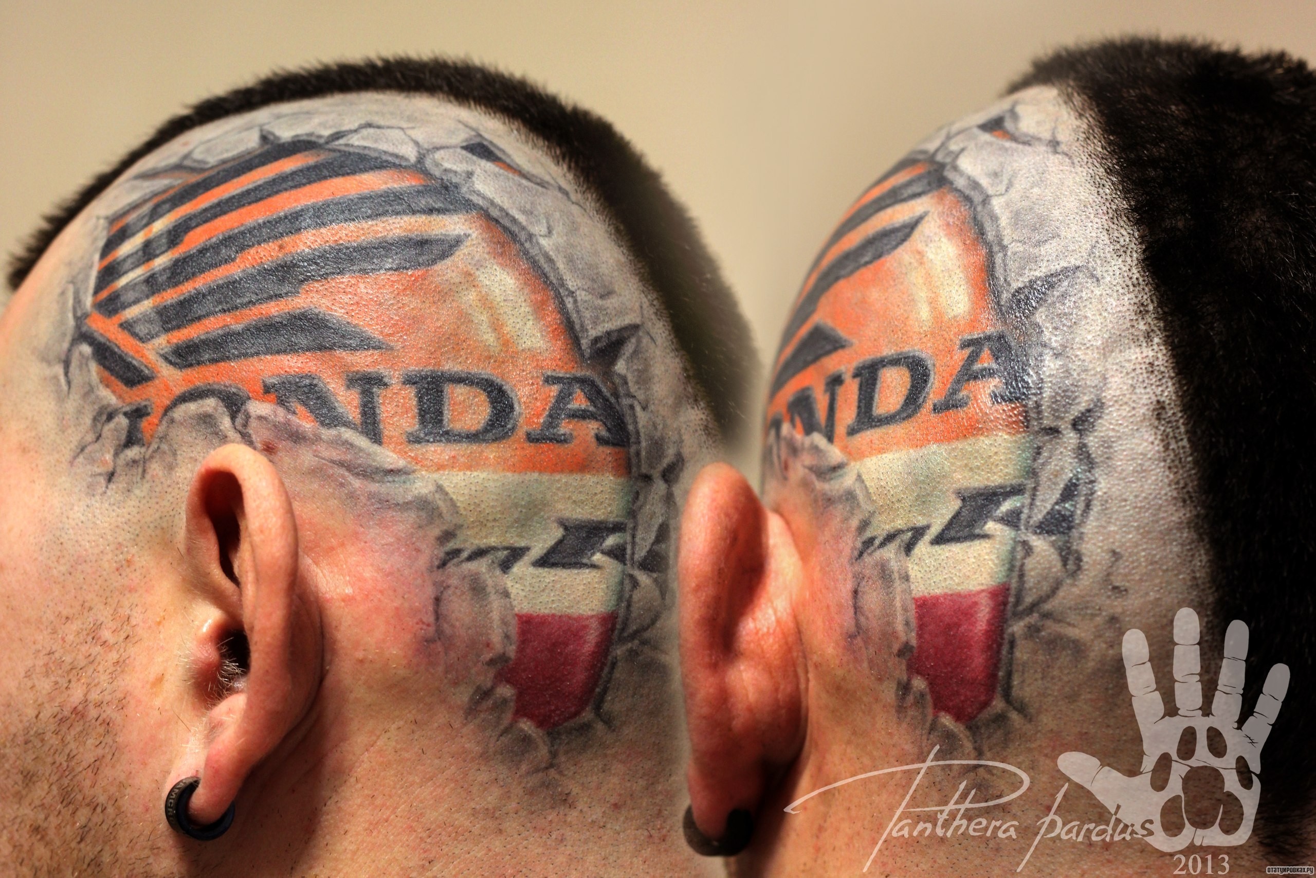 Фотография татуировки под названием «Хонда логотип на голове»