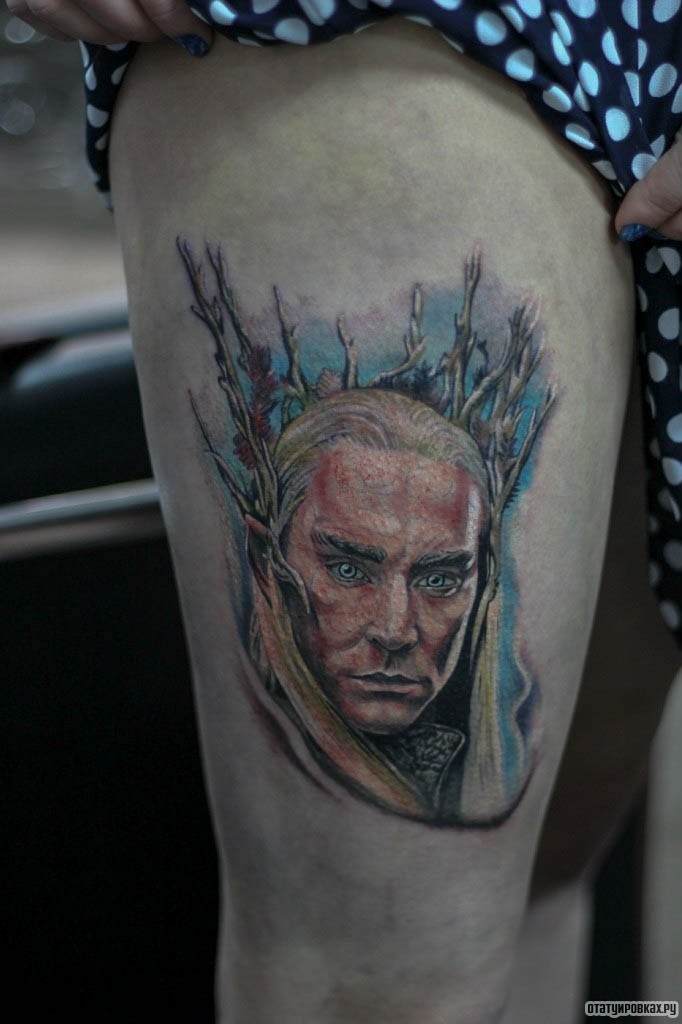 Фотография татуировки под названием «Человек с ветками из головы»