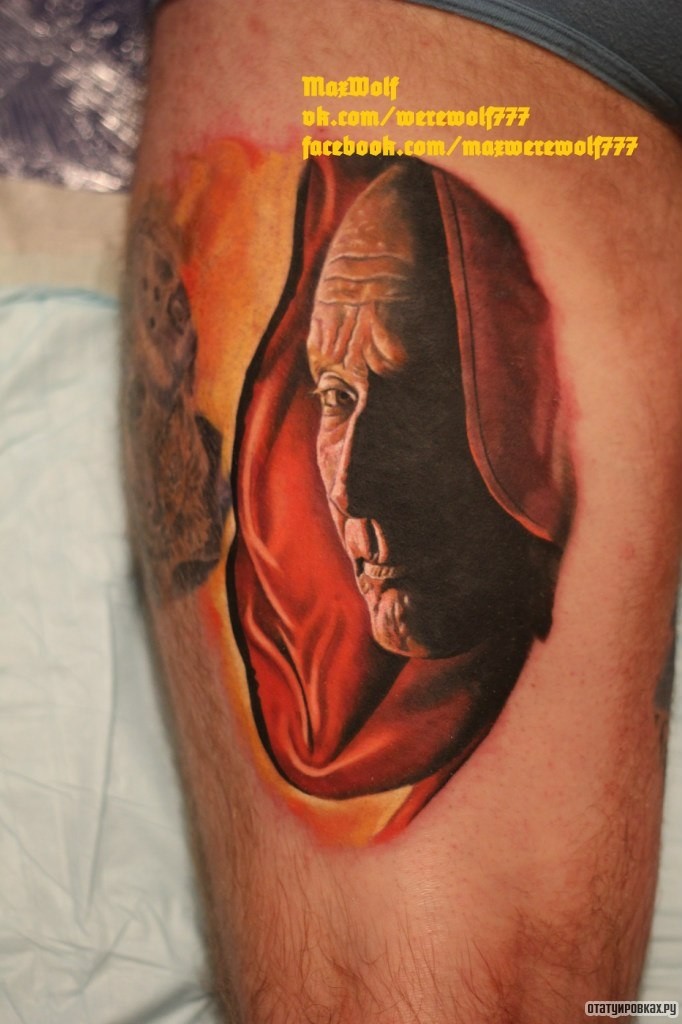 Фотография татуировки под названием «Лицо лысого человека»
