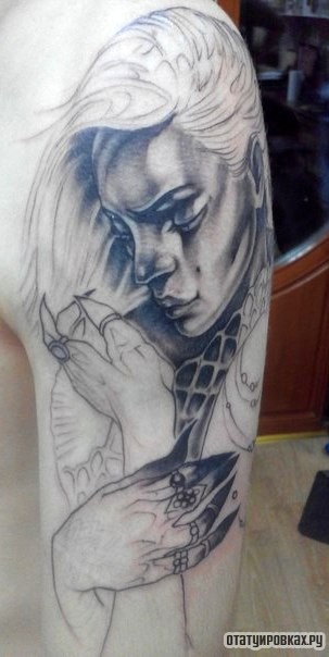 Фотография татуировки под названием «Девушка с коглями»
