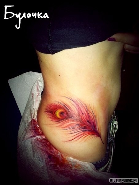 Фотография татуировки под названием «Перо павлина»